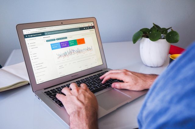 Man using Google Search Console on a laptop