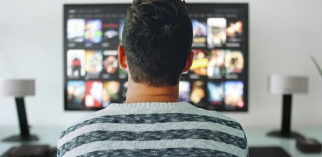 Man watching streaming service on TV
