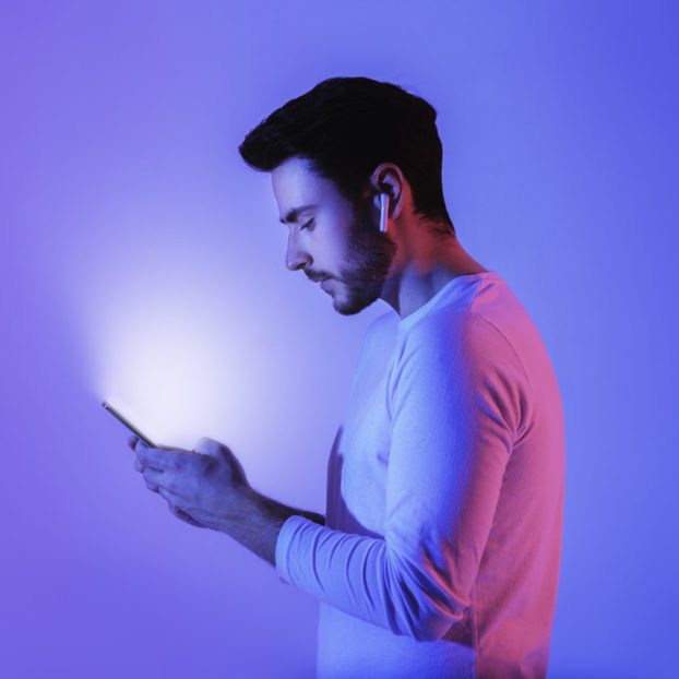 Glow of phone in hands